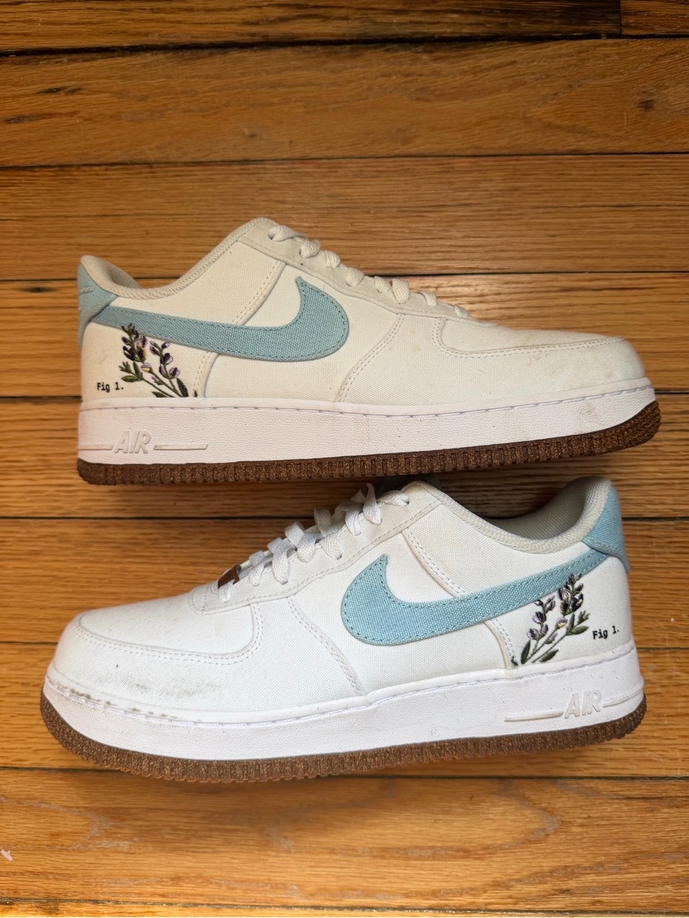Nike Kids White Sneakers with Light Blue Swoosh and Floral Accent